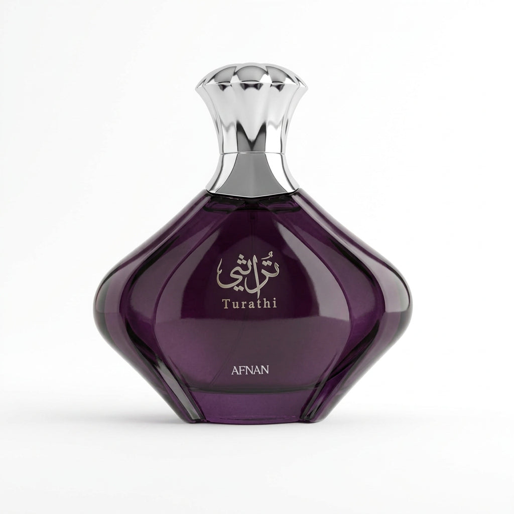 A faceted dark purple glass perfume bottle with a metallic silver cap, featuring the brand name AFNAN and the product name Turathi on the front.