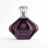 A faceted dark purple glass perfume bottle with a metallic silver cap, featuring the brand name AFNAN and the product name Turathi on the front.