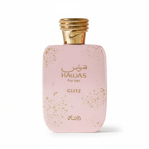 A pink rectangular perfume bottle with gold speckles and a gold cap, labeled 'HAWAS For Her' and 'GLITZ' on a plain white background.
