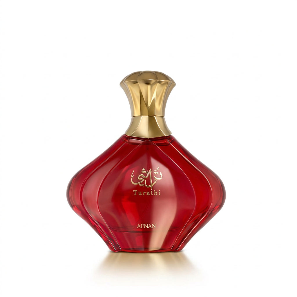A red perfume bottle with a gold cap, featuring Arabic calligraphy and the brand name AFNAN on a clean white background.
